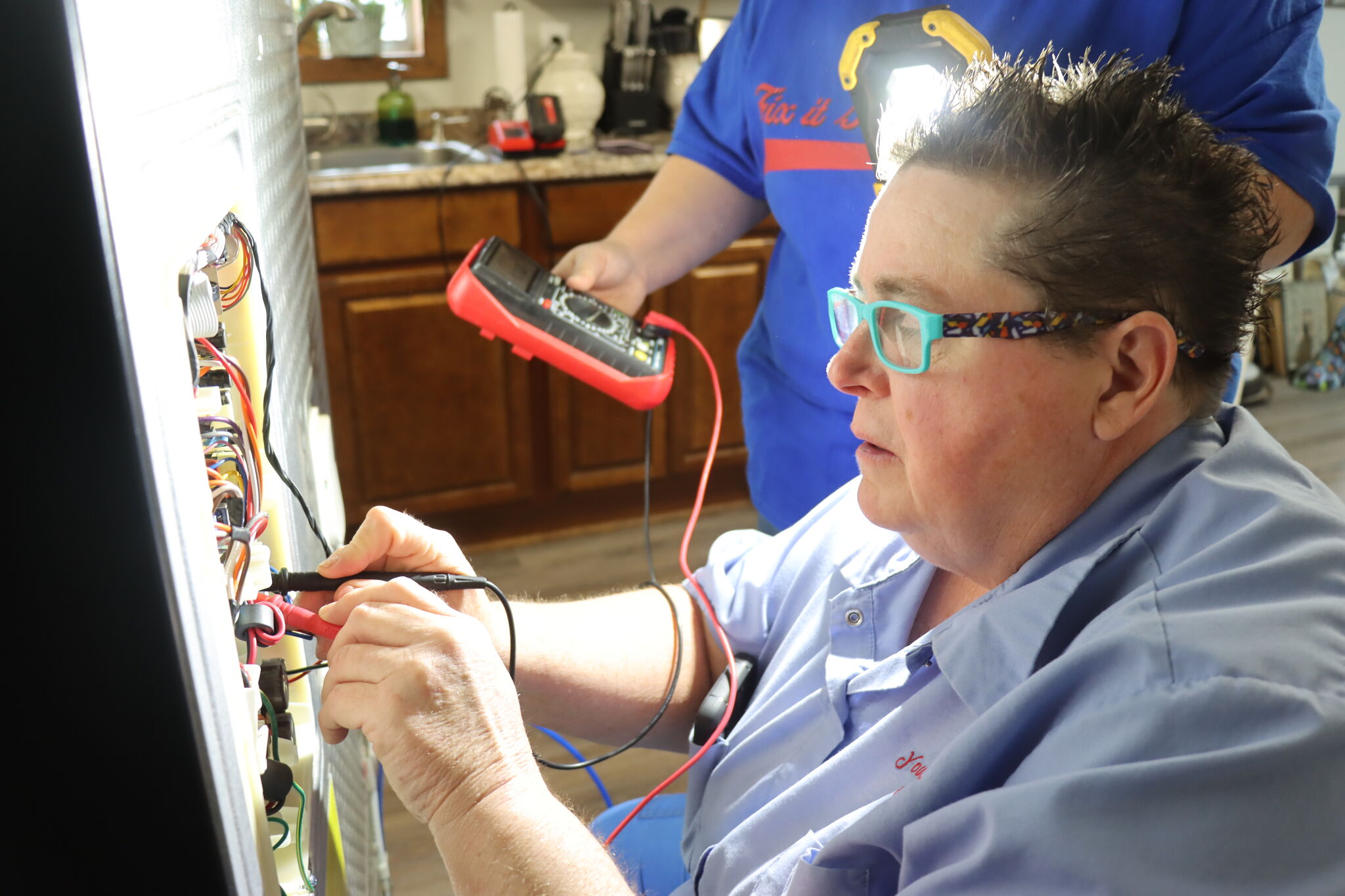 Southeast Texas woman fixing appliances, and also doing much more